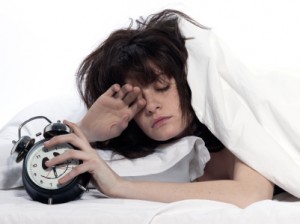 young woman in a white sheet bed on white background