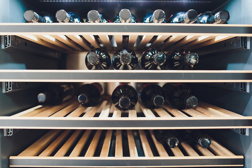 Storing Bottles Of Wine In Fridge. Alcoholic Card In Restaurant. Cooling And Preserving Wine.