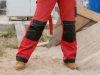 unrecognizable,person,on,construction,site,wearing,protective,worker,red,black