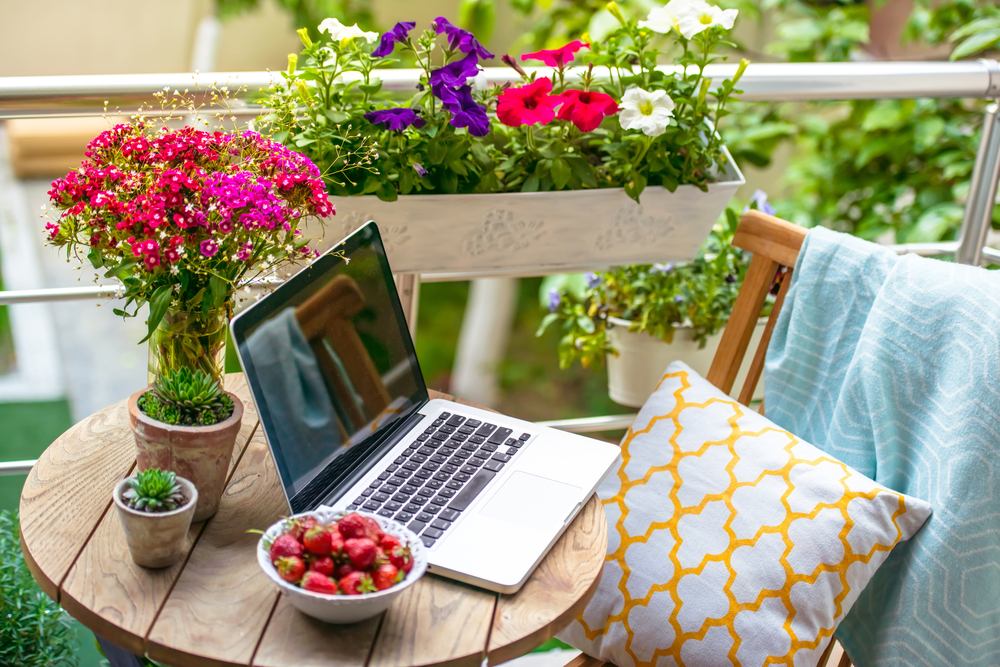 beautiful,terrace,or,balcony,with,small,table,,chair,and,flowers.